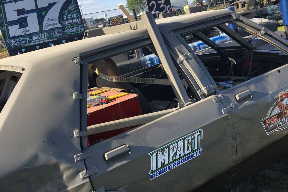 Impact Derby Products demolition derby car with logo on the side.